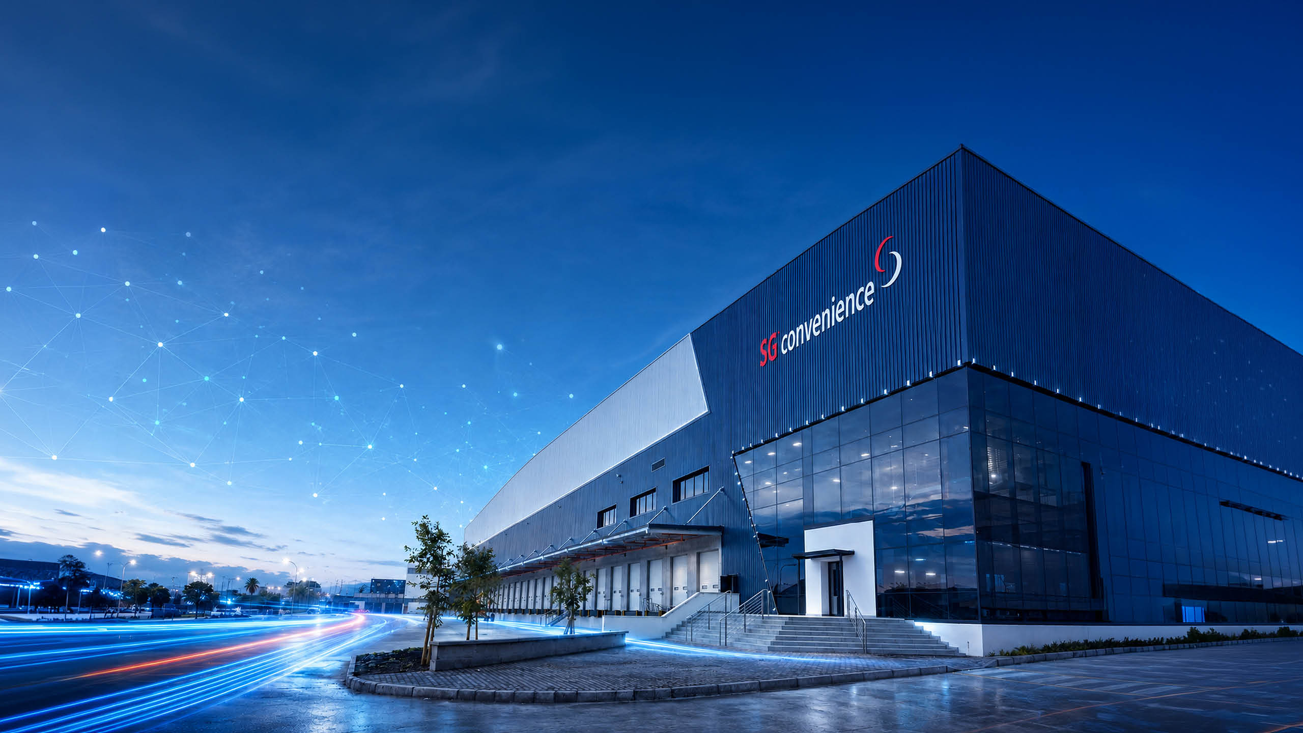 The SG Convenience distribution centre at dusk, its name on the building.